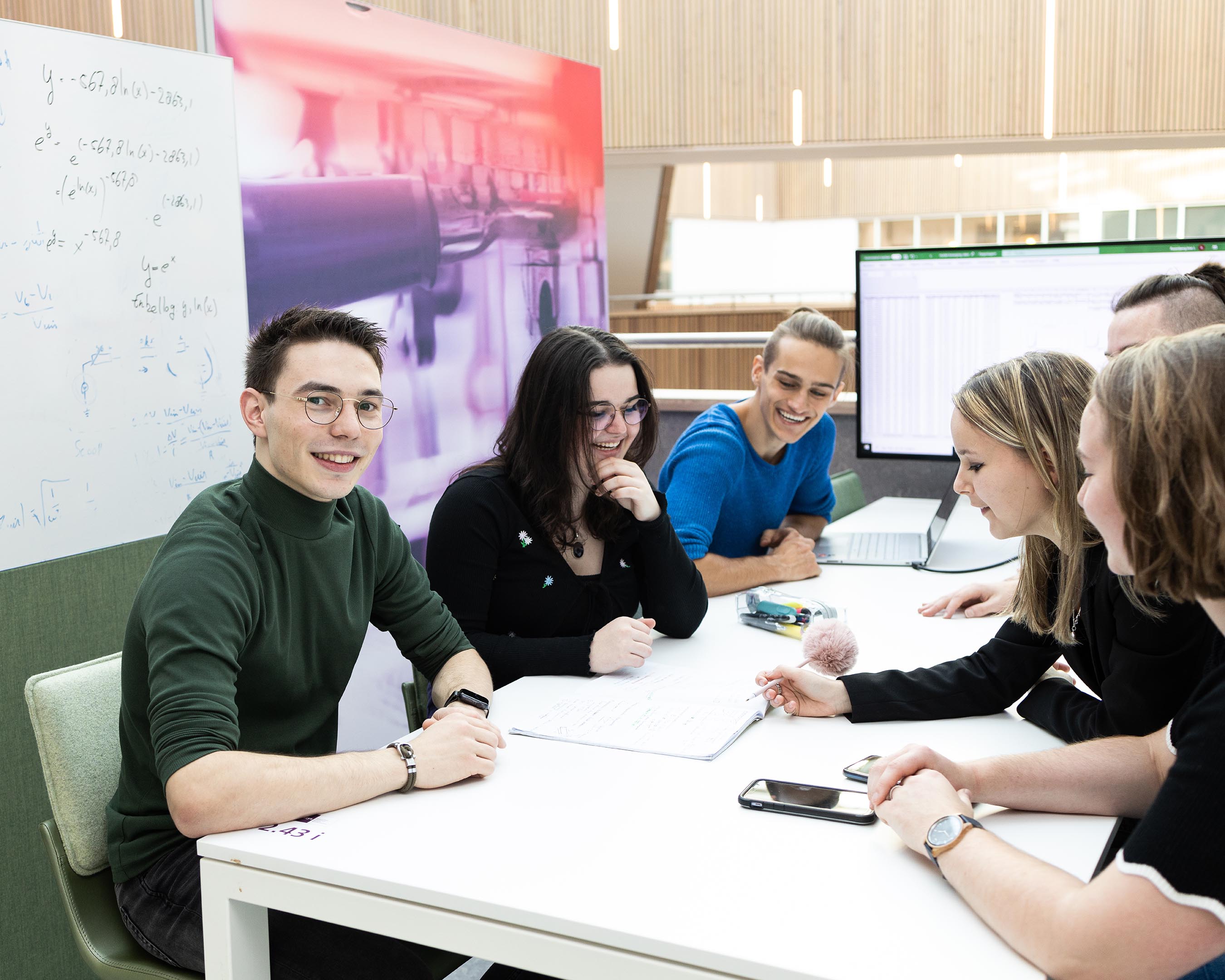 Group of Applied Physics students working on a group assignment