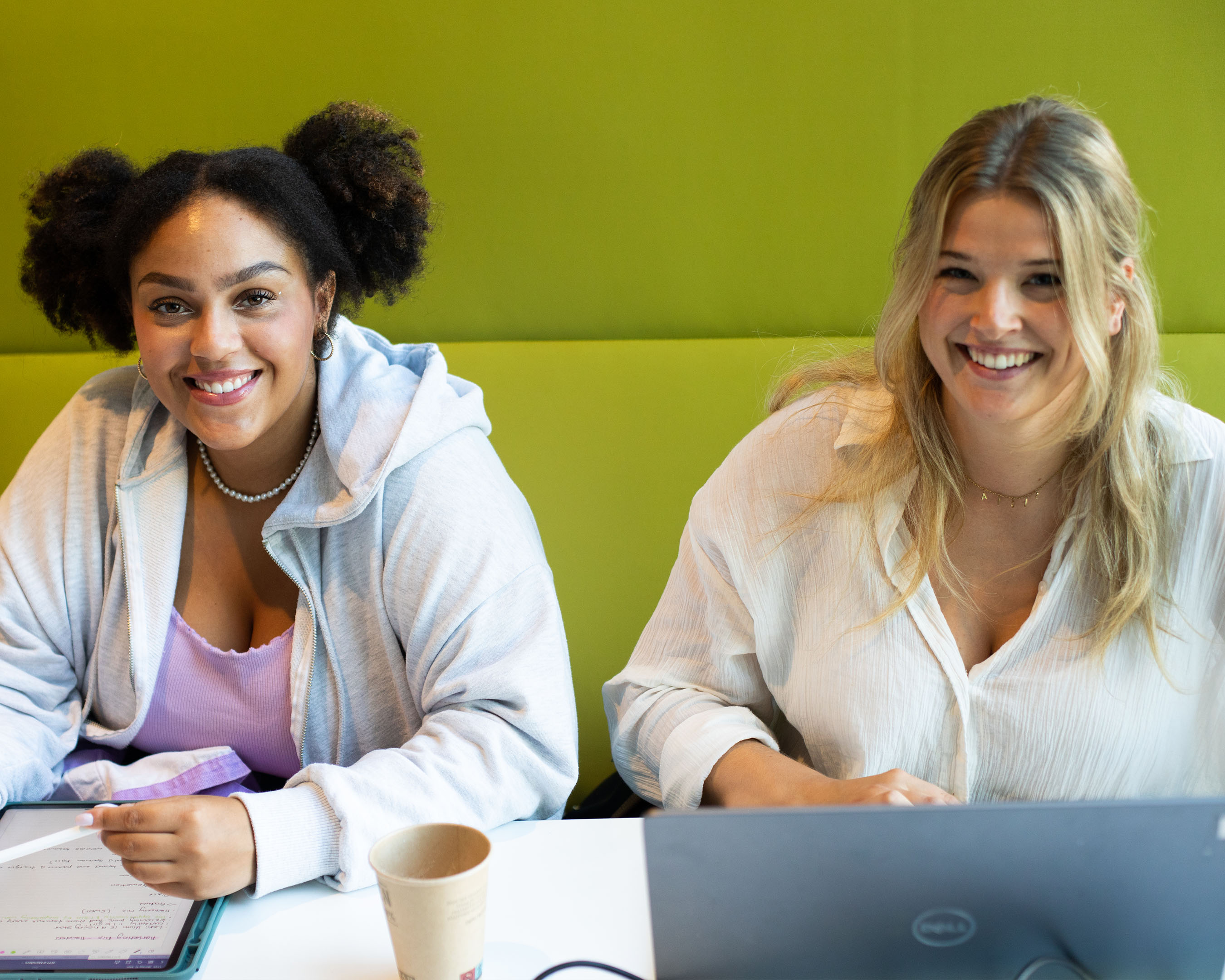 Two students laughing