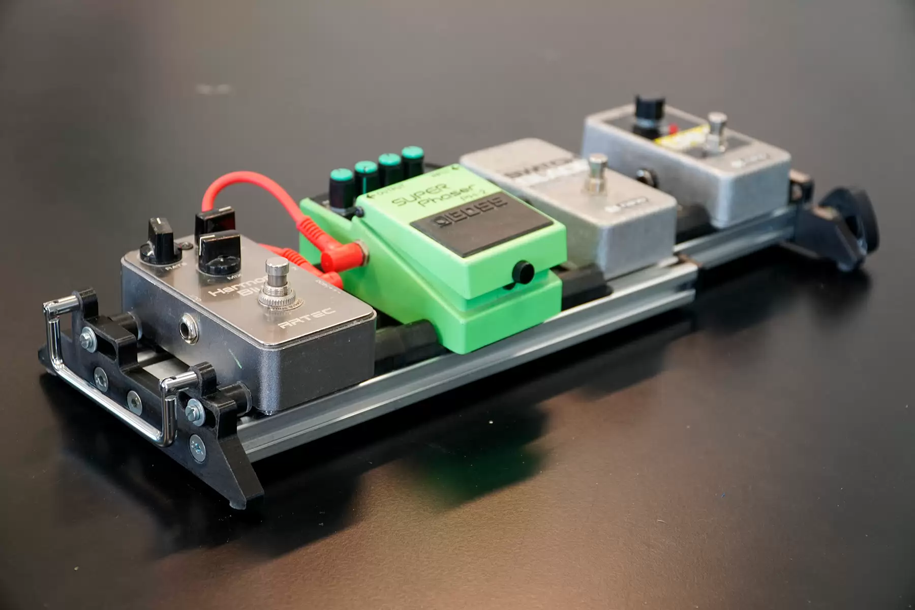 A modular pedal board for guitarists, which is the result of a project that started from someones fascination with guitar playing and the struggles with existing pedal boards.