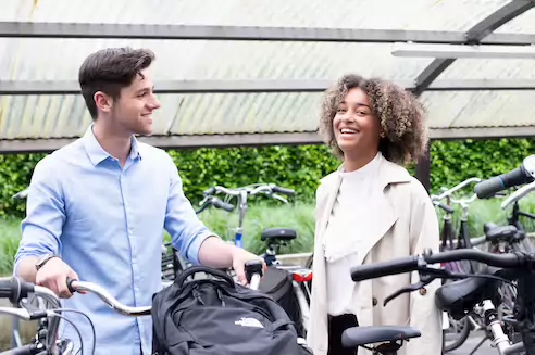 Two students with bikes