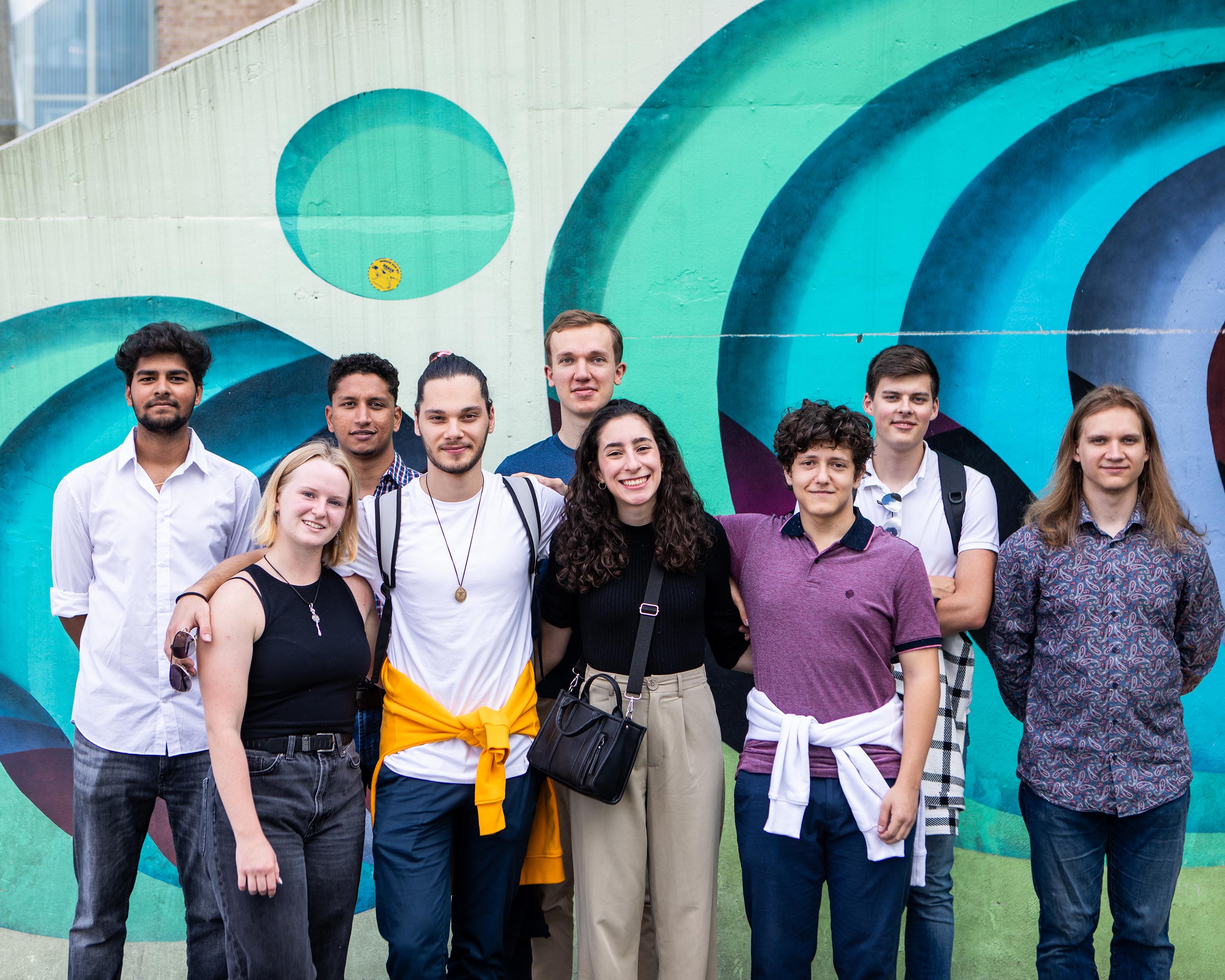 A diverse group of students smiling.