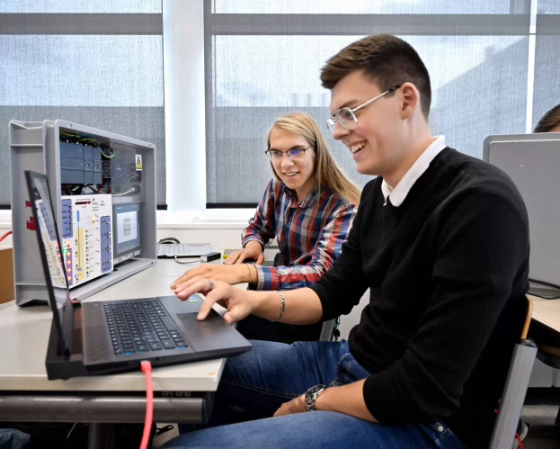 Two Mechatronics students working together on a project