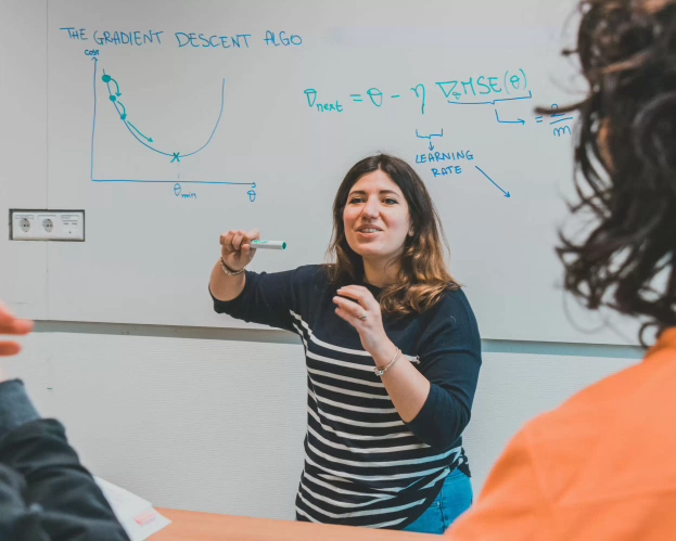 Teacher Master Digital Technology Engineering in front of whiteboard